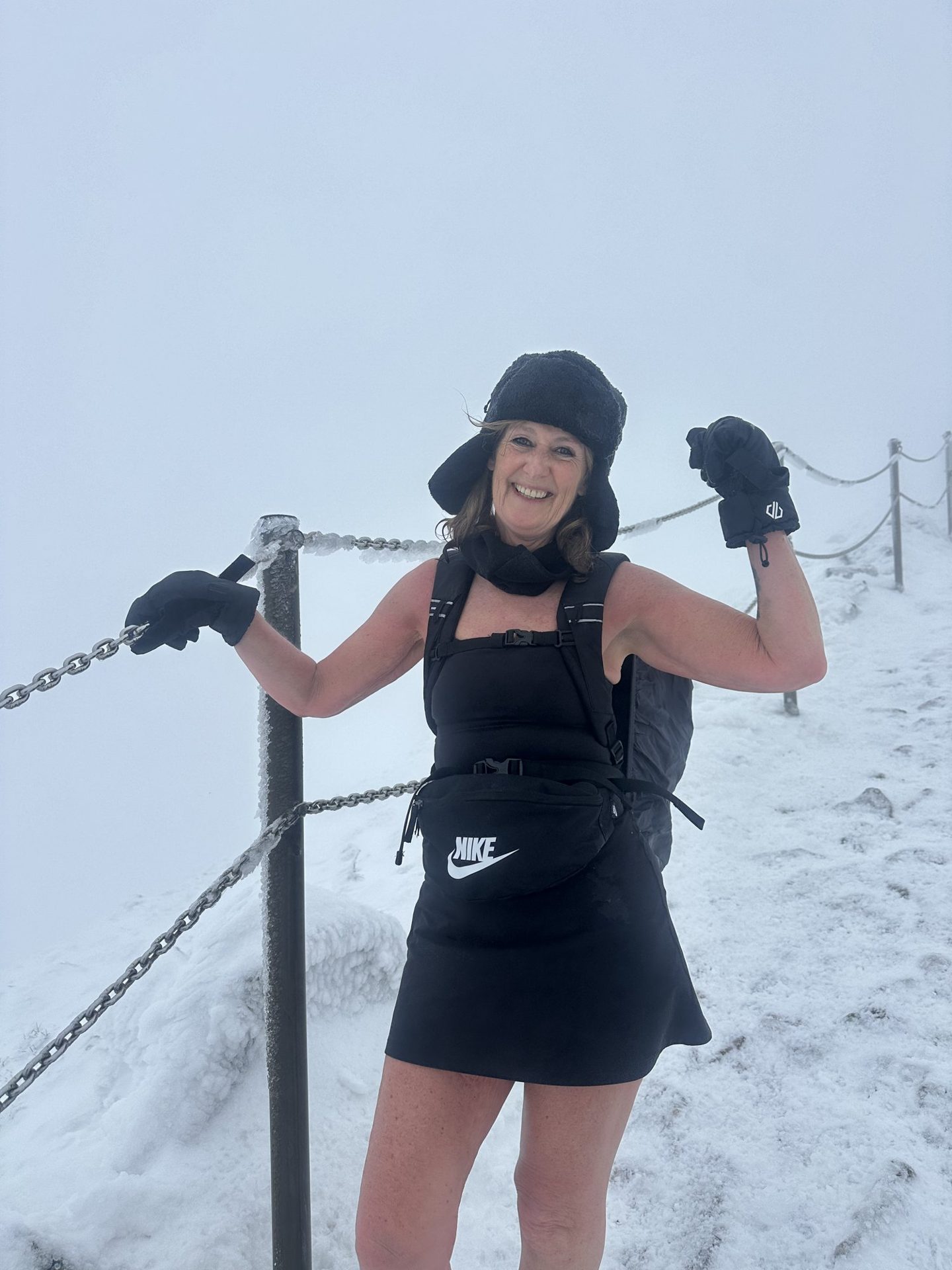 A participant on a snowy summit